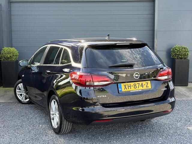 Opel ASTRA Sports Tourer 1.4 Turbo Online Edition ?150pk?2e Eigenaar?Camera?Carplay?Navi?Pdc V+A?Stoelverw?Stuurverw?Clima?Cruise?Lm velgen?6 Bak?Comfortstoelen?Dealer Onderhouden?N.A.P?Bj 12-2018?Apk tot 01-2027