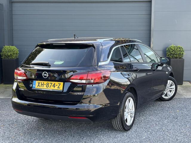 Opel ASTRA Sports Tourer 1.4 Turbo Online Edition ?150pk?2e Eigenaar?Camera?Carplay?Navi?Pdc V+A?Stoelverw?Stuurverw?Clima?Cruise?Lm velgen?6 Bak?Comfortstoelen?Dealer Onderhouden?N.A.P?Bj 12-2018?Apk tot 01-2027