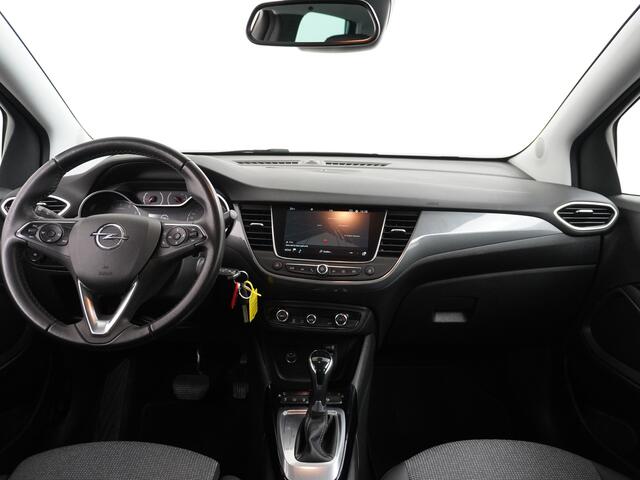 Opel Crossland 1.2T 131pk AUT-6 Turbo Apple Carplay Android Auto 360°Camera Navi Ecc Cruise Control AGR-Comfort Stoel Pdc DAB+ Elegance Lmv 16" Lane Assist Regen-Lichtsensor Led Aut.Dim.Binnenspiegel Verkeersbord detectie Privacyglas Zeer compleet! Facelift model!