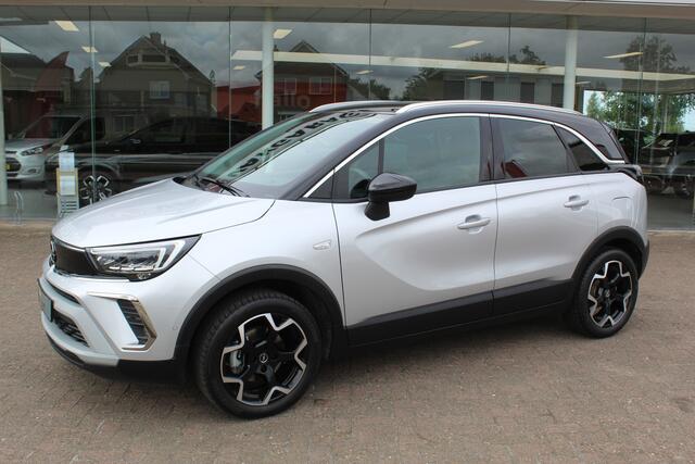 Opel Crossland 1.2-110pk Turbo 'Elegance'. Mooie en luxe hoogzitter met weinig km's ! Volautm. airco dual, cruise control, camera, comfortstoelen, metallic lak, LM wielen, navigatie, telefoonvoorb., lane- en side assist, parkeersensoren v+a, LED verlichting etc.