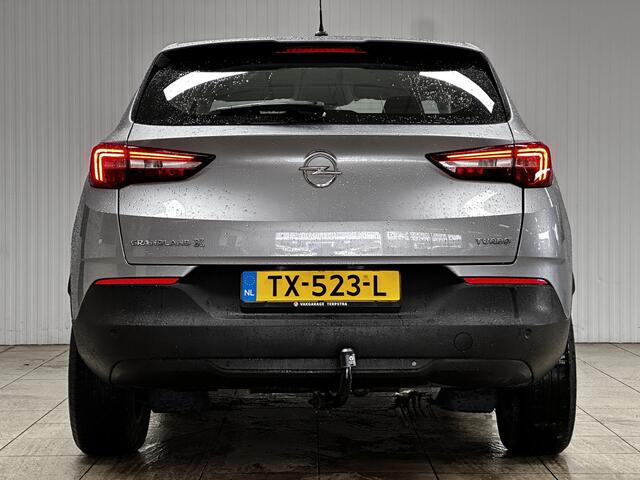 Opel Grandland X 1.2 Turbo Online Edition/ D-Riem verv: 163.000 KM!/ Trekhaak/ 17'' LMV/ Apple + Android/ Airco/ Cruise/ Elek. pakket/ Isofix/ Bluetooth/ Armsteun/ Multi. LEDER. Stuur/ PDC/ LED Dagrijverl.