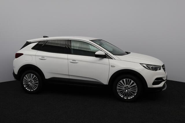 Opel Grandland X 1.2 Turbo Innovation/ D-RIEM VERV: 53.000 KM!/ Camera/ 18'' LMV/ Apple + Android/ Lane-Assist./ Dode-Hoek DET./ Clima/ Cruise/ Bluetooth/ Multi. LEDER. Stuur/ Mistl./ PDC V+A/ Extra getint glas.