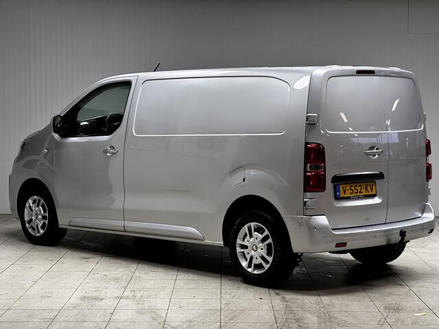 Peugeot EXPERT 231L 2.0 BlueHDI 120 Premium/ Zij-Schuifdeur rechts/ 3-Zitplaatsen voor/ Trekhaak/ Camera/ Apple + Android/ Keyless/ Half-Leder/ DAB+/ Dode-Hoek DET./ Navi/ Airco/ Cruise/ Bluetooth/ PDC/ LED Dagrijverl.