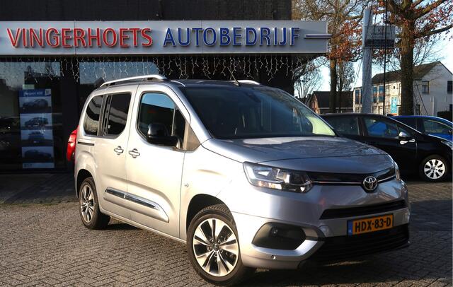 Peugeot Rifter 130 Pk ** AUTOMAAT ** (Toyota ProAce Citroen Berlingo) * Climate & Cruise Control * Trekhaak * L.M. Velgen * Navigatie & Spotify via Apple Carplay / Android Auto * Stoelverwarming * Vierseizoenenbanden Michelin * Vingerhoets; Vierde Generatie Eersteklas S