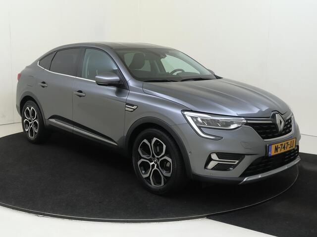 Renault Arkana 1.6 E-Tech Hybrid 145 Intens | Automaat | Stoelverwarming | Verwarmd Stuurwiel | Navigatie | Airco | Adaptieve Cruise Control | Parkeersensoren Voor + Achter | Parkeer Camera Achter