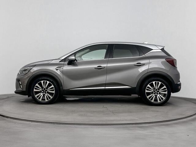 Renault CAPTUR 1.3 TCe 140Pk Initiale Paris | Navigatie | Apple Carplay/Android Auto | Achteruitrijcamera | Parkeersensoren Voor en Achter | Verwarmbare Voorstoelen | Dodehoek Detectie | Elektrisch Verstelbare Bestuurdersstoel | Bose Audioinstallatie |
