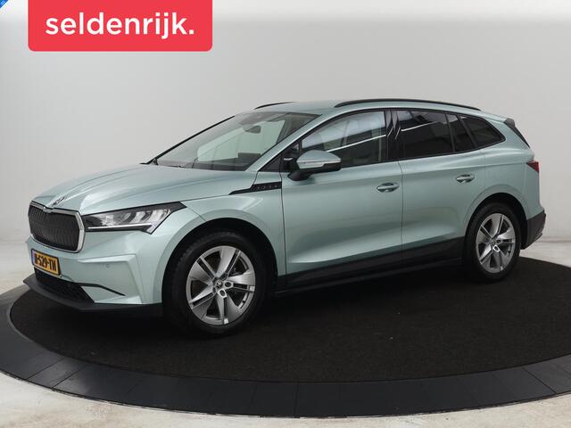 Skoda Enyaq iV 60 | SOH 91% | Trekhaak | Stoelverwarming | Camera | Sportstuur | Carplay | Navigatie | Cruise control | Full LED | Half leder | DAB | Parkeerhulp | Sfeerverlichting | Climate control