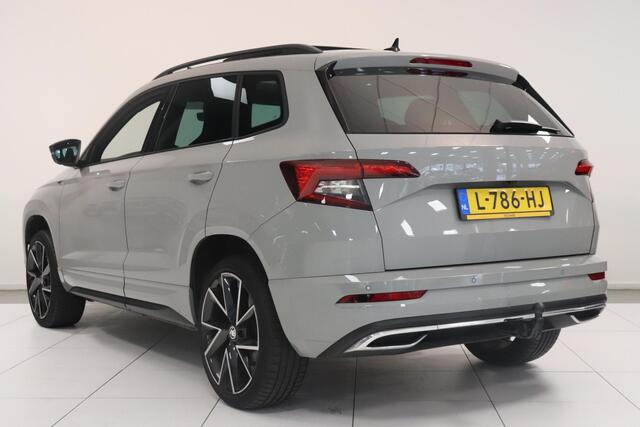 Skoda Karoq 1.5 TSI ACT Sportline Business | Adaptieve cruisecontrol | Camera | Panoramadak | Trekhaak | CANTON audio | Elektr achterklep | Stuur en stoel verwarming |