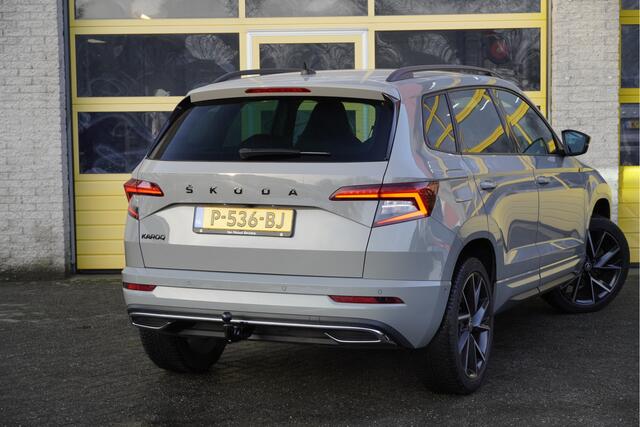 Skoda Karoq 1.5 TSI ACT 150PK! Automaat Sportline Business BJ2022 Lmv 19" | Led V+A | Pdc | Navi | Keyless entry | Elek. trekhaak | Verwarmd voorruit | Achteruitrijcamera | App-Connect | Virtual cockpit | Canton Audio | Verwarmde voorstoelen/stuurwiel | Zwarte hemel
