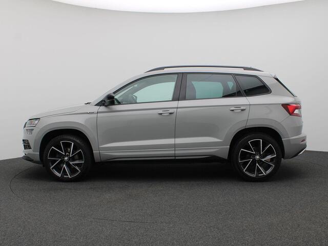 Skoda Karoq 1.5 TSI ACT Sportline Business 150PK DSG Trekhaak, Canton Audio, 19" LM Velgen, Elektr. Achterklep, Keyless, Adaptieve Cruise Controle, Achteruitrijcamera, Side Assist, Stoelverwarming, Voorruitverwarming