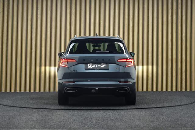 Skoda Karoq 1.5 TSI ACT Sportline Business DSG | Adaptive-cruise | Trekhaak | Camera | Clima | Stuur & Stoelverwarming | Navigatie | Virtual-Cockpit | Apple Carplay & Android Auto | Elek. Achterklep | Keyless | Dodehoekdetectie