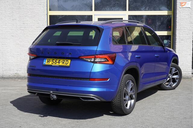 Skoda Kodiaq 1.5 TSI 150PK! Automaat Sportline Business BJ2020 Lmv 19" | Led | Pdc | Navi | Keyless entry | Elek. trekhaak | Elek. achterklep | Achteruitrijcamera | App-Connect | Canton Audio | Virtual cockpit | Elek. Be stoel+Mem | Verwarmde voorstoelen