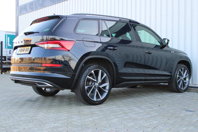 Skoda Kodiaq 1.5 TSI Sportline Business | Incl. 12 maanden garantie | Wegklapbare trekhaak | Apple CarPlay | Canton audio | Adaptive cruise | Stoelverwarming | Achteruitrij camera | Parkeersensoren |