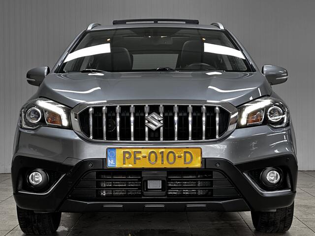 Suzuki S-Cross 1.0 Boosterjet High Executive/ Trekhaak/ Panorama-Dak/ Camera/ Apple + Android/ Leder/ Adaptive Cruise/ LED Koplampen/ Keyless/ Extra getint glas/ PDC V+A/ Navi/ Stoelverw./ Bluetooth/ Multi. LEDER. Stuur.