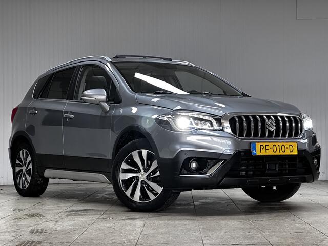 Suzuki S-Cross 1.0 Boosterjet High Executive/ Trekhaak/ Panorama-Dak/ Camera/ Apple + Android/ Leder/ Adaptive Cruise/ LED Koplampen/ Keyless/ Extra getint glas/ PDC V+A/ Navi/ Stoelverw./ Bluetooth/ Multi. LEDER. Stuur.