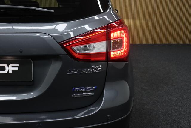Suzuki S-Cross 1.4 Boosterjet AllGrip Style Smart Hybrid | Elek. Glazen Panoramadak | Adaptive-cruise | Afneembare Trekhaak | Leder | Camera | Clima | Parkeerhulp | Apple Carplay & Android Auto | Navigatie | Keyless | Stoelverwarming