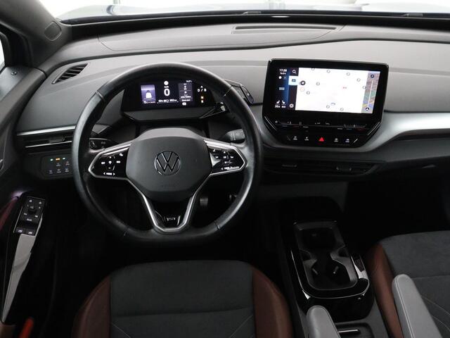 Volkswagen ID.4 First 77 kWh | SOH 90% | Stoel & stuurverwarming | Adaptive cruise | Camera | Carplay | Half leder | Navigatie | 20'' | Full LED | Keyless | Climate control | Sfeerverlichting