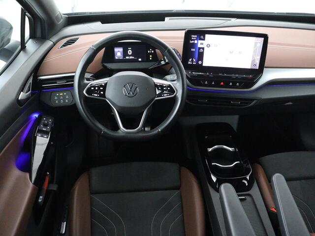 Volkswagen ID.4 Tech 77 kWh | SOH 92,2% | Panorama | 360 Camera | Head up | Virtual cockpit | Sfeerverlichting | Stoel/Stuurverwarming | Adaptive cruise | Carplay | Traffic assist | Climate control | Half leder/velours