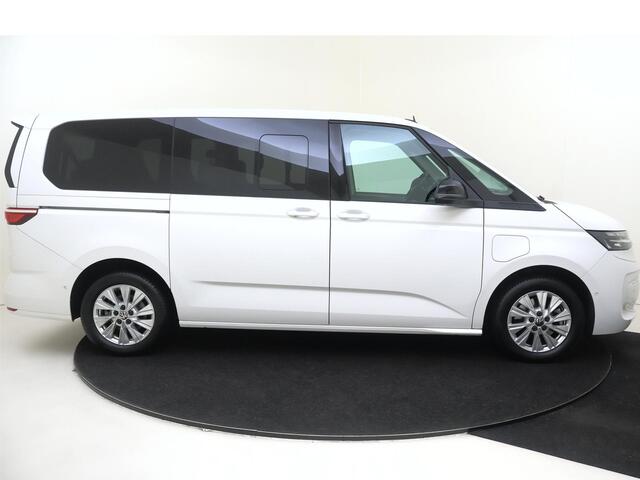 Volkswagen MULTIVAN 1.4 eHybrid L2 Style 6 versnellingen DSG | SoH 94% | 7p | Parkeerassistent | Stoelverwarming | Achteruitrijcamera | Navigatie | 3-zone airco | CarPlay |
