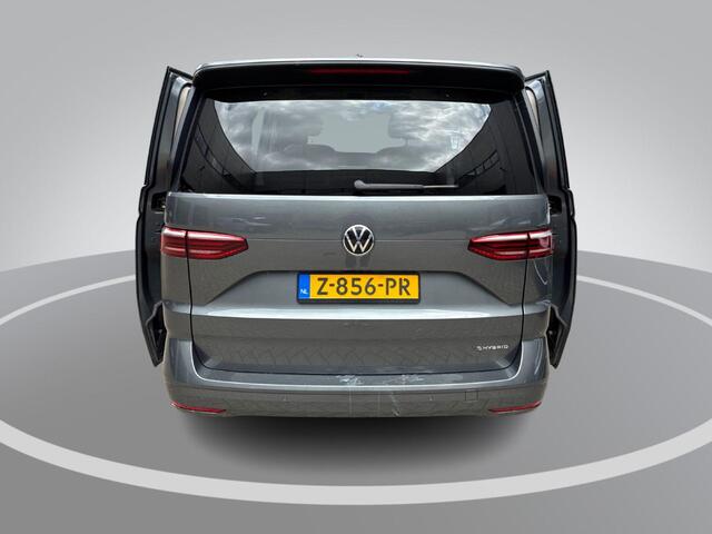Volkswagen MULTIVAN 1.4 218pk DSG eHybrid L2H1 Life Business · Glazen dak · Trekhaak · Camera · Elek. Schuifdeuren · Apple/Android Car Play · 7 Persoons · 18'' Inch · Garantie t/m 02-06-2028 of 100.000km