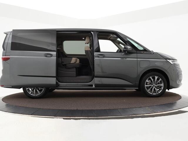 Volkswagen MULTIVAN 1.4 218pk DSG eHybrid L2H1 Life Business · Glazen dak · Trekhaak · Camera · Elek. Schuifdeuren · Apple/Android Car Play · 7 Persoons · 18'' Inch · Garantie t/m 02-06-2028 of 100.000km