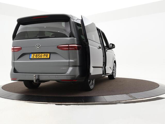 Volkswagen MULTIVAN 1.4 218pk DSG eHybrid L2H1 Life Business · Glazen dak · Trekhaak · Camera · Elek. Schuifdeuren · Apple/Android Car Play · 7 Persoons · 18'' Inch · Garantie t/m 02-06-2028 of 100.000km