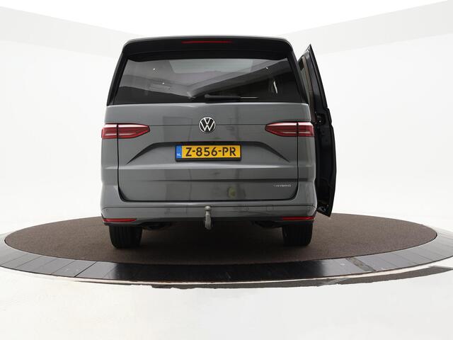 Volkswagen MULTIVAN 1.4 218pk DSG eHybrid L2H1 Life Business · Glazen dak · Trekhaak · Camera · Elek. Schuifdeuren · Apple/Android Car Play · 7 Persoons · 18'' Inch · Garantie t/m 02-06-2028 of 100.000km