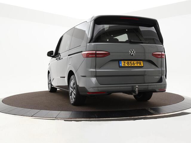 Volkswagen MULTIVAN 1.4 218pk DSG eHybrid L2H1 Life Business · Glazen dak · Trekhaak · Camera · Elek. Schuifdeuren · Apple/Android Car Play · 7 Persoons · 18'' Inch · Garantie t/m 02-06-2028 of 100.000km