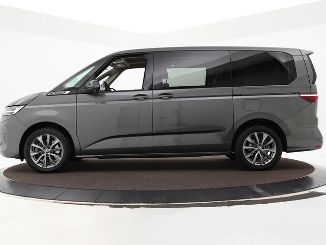 Volkswagen MULTIVAN 1.4 218pk DSG eHybrid L2H1 Life Business · Glazen dak · Trekhaak · Camera · Elek. Schuifdeuren · Apple/Android Car Play · 7 Persoons · 18'' Inch · Garantie t/m 02-06-2028 of 100.000km