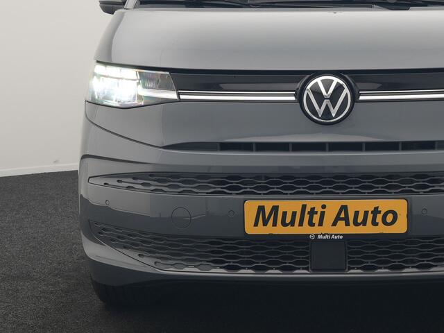 Volkswagen MULTIVAN 1.4 eHybrid Bulli 7 Zits PHEV 218pk Dealer O.H | Trekhaak Af Fabriek | Adaptive Cruise | Camera | Sportstoelen & Stuur Verwarmd | Apple Carplay | BLIS | Navigatie | Virtual | DAB | 17"L.M | Plug In Hybrid |
