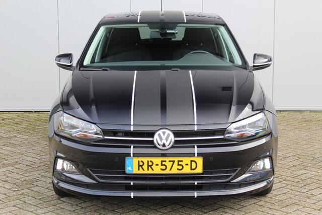 Volkswagen POLO 1.0-95pk TSI Comfortline. Zeer nette, sportieve en keurig onderhouden VW Polo. Trekhaak met afneemb. kogel, pdc v/a, volautm., camera, airco, cruise, navi, lmv etc.