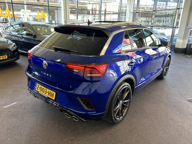 Volkswagen T-Roc 2.0 TSI 4Motion R | Panoramadak | Keyless | Beats | Dealer onderhouden | Adaptieve cruise control | Dodehoeksdetectie | Lane assist | Digital dashboard | Afneembare trekhaak | Achteruitrijcamera | Climate control | Navigatie | Stoelverwarming