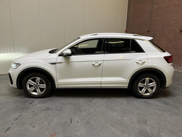 Volkswagen T-Roc 1.5 TSI R-Line / AUTOMAAT/ GARANTIE TM 04-2027/ STUUR+STUUR VERWARM./ TREKHAAK/ ELEK. ACHTERKLEP/ CAMERA/ PARK. SENSOREN V+A/ APP-CONNECT/ KEYLESS/ DRIVE SELECT/ DODE HOEK/ NAVI/ DAB/ LED/ ACC/ CLIMA/ ISOFI