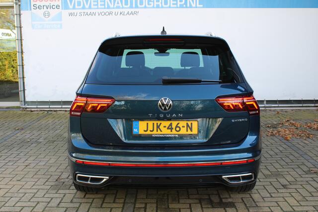 Volkswagen TIGUAN 1.4 TSI eHybrid R-Line Business+ | Incl. 12 maanden Garantie | Panorama dak | Memory stand stoelen | Trekhaak wegklapbaar | Stoel & Stuurverwarming | 360* Camera | Climate controle | Adaptive cruise | Elektrische kofferbakklep | Dodehoek detectie | IQ. Li