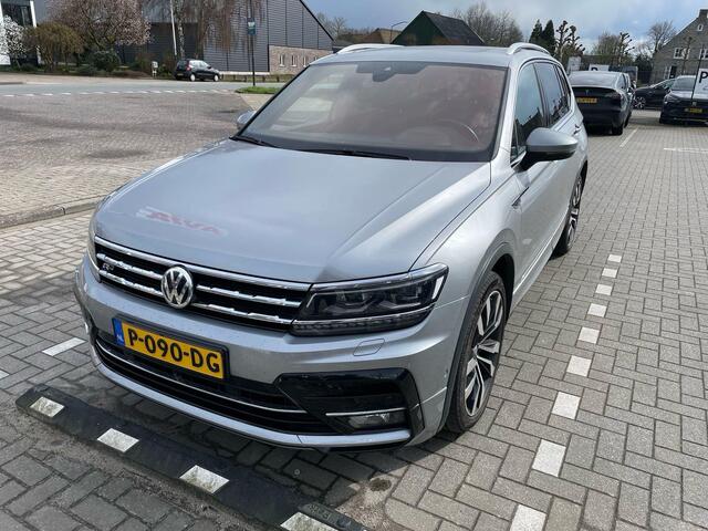 Volkswagen TIGUAN 2.0 TSI 4Motion R-Line 7p 7 zits r-line in en exterieur panoramadak 20" LMV Suzuka head up display discover pro navi digital cockpit pro area view rondom zicht camera verwarmbare voorruit stoelverwarming elektrische achterklep keyless entry wegklapbare tr