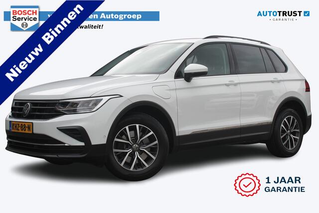 Volkswagen TIGUAN 1.4 TSI eHybrid R-Line Business+ | Incl. 12 Maanden garantie | Stoelverwarming | Stuurverwarming | Adaptieve cruise | Apple Carplay/Android Auto | Memory seats | Navigatie | Parkeersensoren | Parkeercamera | Trekhaak |