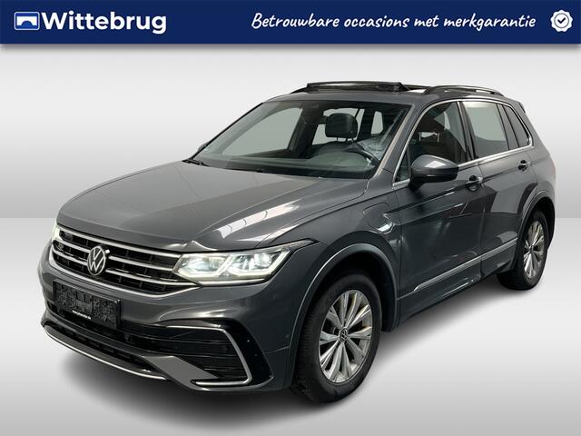 Volkswagen TIGUAN 1.4 TSI eHybrid R-Line / AUTOMAAT/ PANO/ ACC/ PARK.SENSOR.V+A/ CAMERA/ APP-CONNECT/ STUUR+STOELVERWARM./ ELEK.ACHTERKLEP/ DIGITAL DASH/ NAVI/ DAB/ CLIMA/ IQ.LIGHT/ 19'' LMV