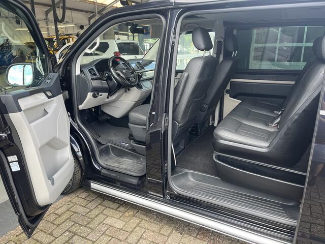Volkswagen TRANSPORTER 2.0 TDI L2H1 DC 2x elektrische schuifdeur Leder Apple carplay Schuifdak Stoelverwarming Trekhaak Navigatiesysteem Sitebars Stuurwielbediening Parkeersensoren voor en achter Euro 6
