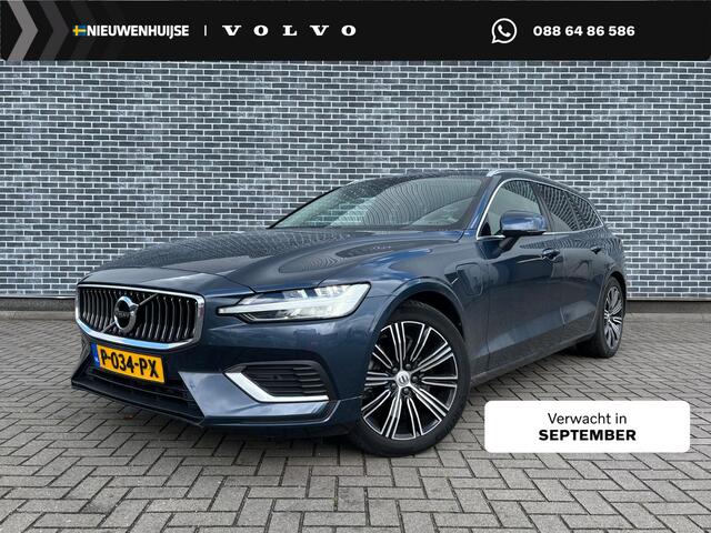 Volvo V60 T6 Plug-in hybrid AWD Ultimate Bright | Long Range | Harman Kardon Audio | Trekhaak | Zitverlenging | Head-Up Display | Panoramadak | Keyless | Camera | Memory | Elek. Stoelen | Adaptieve Cruise Control | Dodehoekdetectie | Stoel-/Stuurverwarming | Lederen Bekleding | Park Assist | Elek. Achterklep | 18 inch Lichtmetalen Velgen