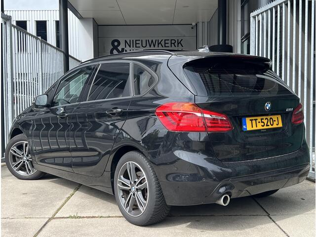 BMW 2-SERIE Active Tourer 218i High Executive | AUTOMAAT | HEAD-UP DISPLAY | LEDER | SCHUIF/KANTELDAK | NAVI XL | CAMERA | CRUISE CONTROL | CLIMATE CONTROL | PDC V+A | LMV 17'' | STOELVERWARMING | BLUETOOTH