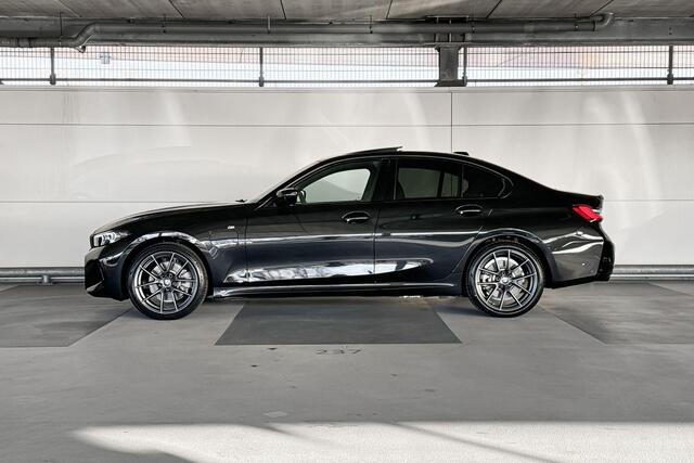 BMW 3-SERIE Touring 320e | M Sportpakket | Trekhaak met elektrisch wegklapbare kogel