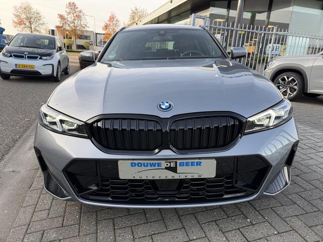 BMW 3-SERIE Touring 320e M sport Pano-Dak | Trekhaak | Adapt. Cruise | Stoelverw. |
