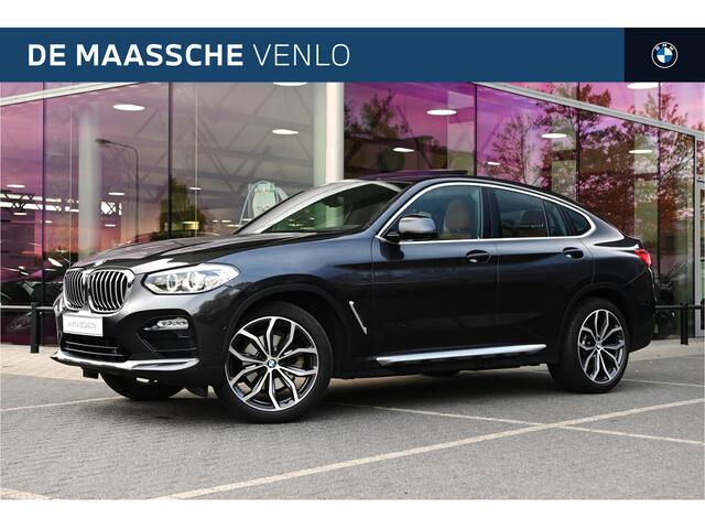 BMW X4 xDrive20i High Executive xLine Automaat / Trekhaak / Panoramadak / Sportstoelen / M Sportonderstel / LED / Parking Assistant Plus / Stoelverwarming / Navigatiesysteem Professional