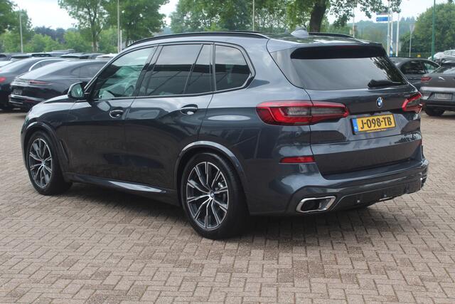 BMW X5 xDrive30d High Exe. 7p. M Sport / Trekhaak / Panoramadak / Camera / Head-up / Softclose / 20'' / Harman Kardon / Luchtvering / Laser LED / Keyless / Leder / Apple CarPlay / Stuurverwarming / DAB / ACC / Zonnescherm zijruite