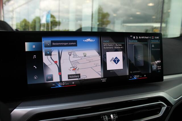 BMW i4 eDrive40 / Schuif-kanteldak / Achteruitrijcamera / Live Cockpit Plus / Parking Assistant / Stoelverwarming