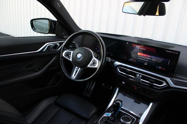 BMW i4 M50 High Executive 84 kWh | Incl. 12 maanden garantie | Assisted driving | Stoel/stuurverwarming | Stoelventilatie | Uitklapbare trekhaak | Head-up display | Memory seat | Schuif/kantel dak | Harman/Kardon | 360° camera |