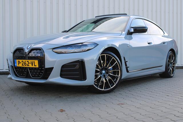 BMW i4 M50 High Executive 84 kWh | Incl. 12 maanden garantie | Assisted driving | Stoel/stuurverwarming | Stoelventilatie | Uitklapbare trekhaak | Head-up display | Memory seat | Schuif/kantel dak | Harman/Kardon | 360° camera |