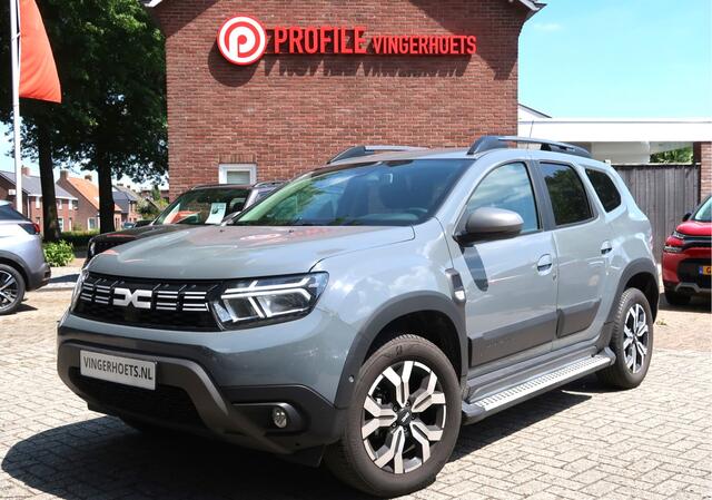 Dacia DUSTER 150 Pk Benzine *** AUTOMAAT * Ruige Stoere Journey Uitvoering * Navigatie * Achteruitrij Camera * Stoelverwarming * Dodehoekdetector * Climate & Cruise Control * Hoge Zit * Stoere Kleur * Vingerhoets; Vierde Generatie Eersteklas Service !