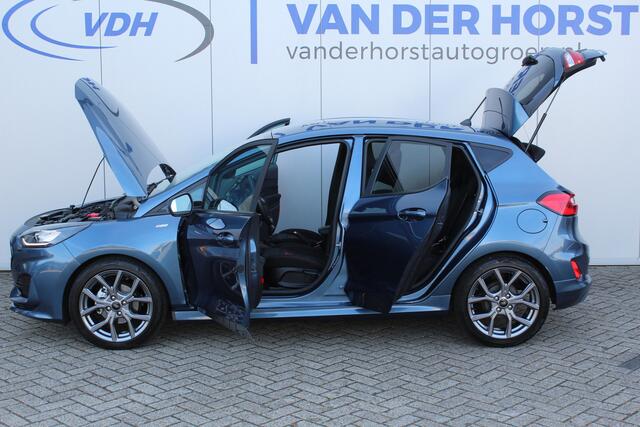 Ford FIESTA 1.0-125pk EcoBoost Mild-Hybrid ST-Line. In nieuwstaat verkerende Ford Fiesta met 125pk van 1e eig. ! Autm. airco, stoel-, stuur- en voorraamverw., LED verl., privacy glass, trekhaak, metallic lak, adaptieve cruise cntrl, navigatie by Apple/Android