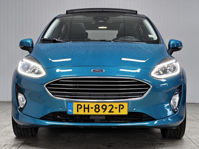Ford FIESTA 1.0 EcoBoost Titanium/ DEALER ONDERHOUDEN!/ B&O/ Camera/ 17'' LMV/ Keyless/ Lane-Assist./ Panorama-Dak/ PDC V+A/ Chroom/ Apple + Android/ DAB+/ Navi/ Clima/ Cruise/ Multi. LEDER. Stuur/ Mistl.